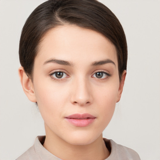 Neutral white young-adult female with short  brown hair and brown eyes