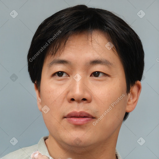 Neutral asian adult male with short  brown hair and brown eyes