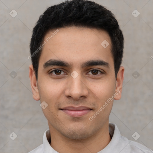 Joyful white young-adult male with short  black hair and brown eyes