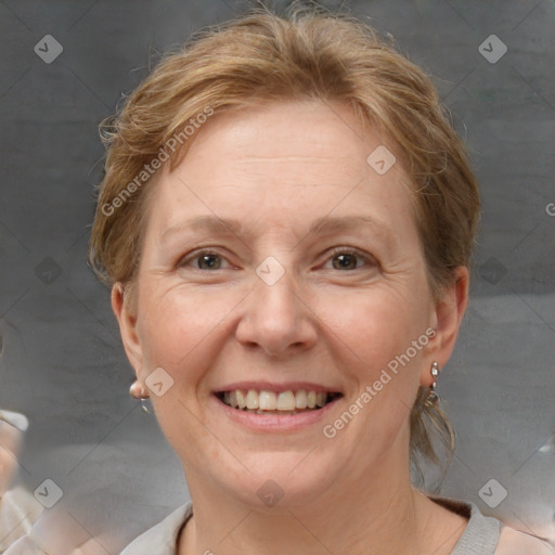 Joyful white adult female with short  brown hair and brown eyes