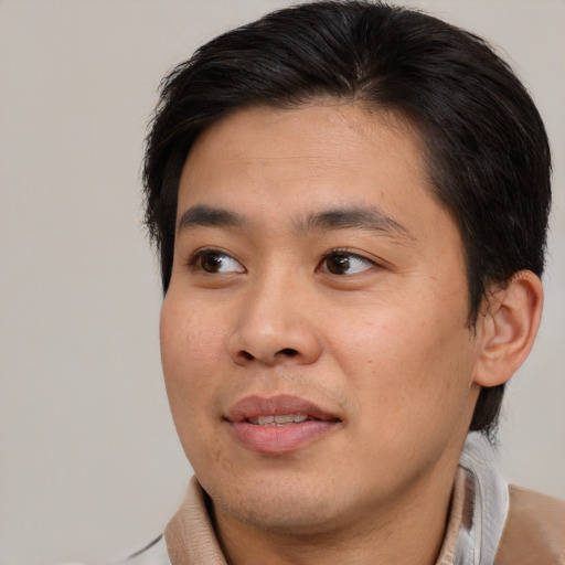 Joyful white young-adult male with medium  brown hair and brown eyes