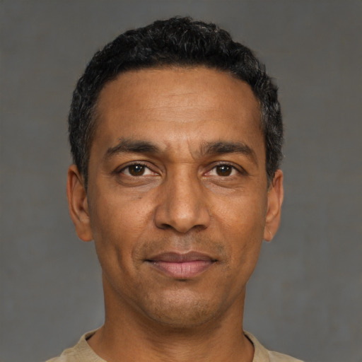 Neutral black adult male with short  black hair and brown eyes