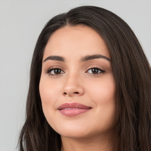 Joyful white young-adult female with long  black hair and brown eyes