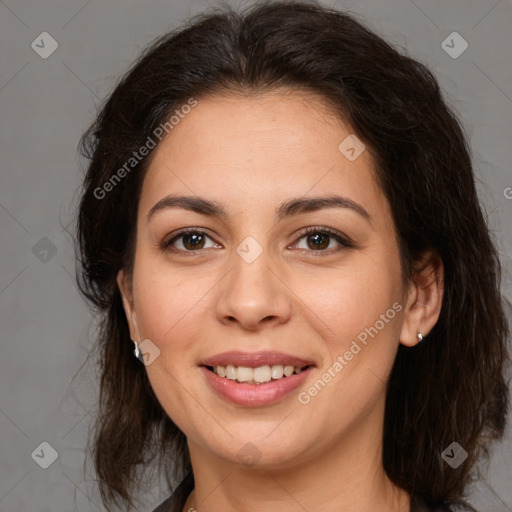 Joyful latino young-adult female with medium  brown hair and brown eyes