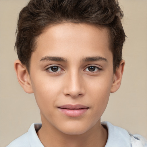 Joyful white child male with short  brown hair and brown eyes