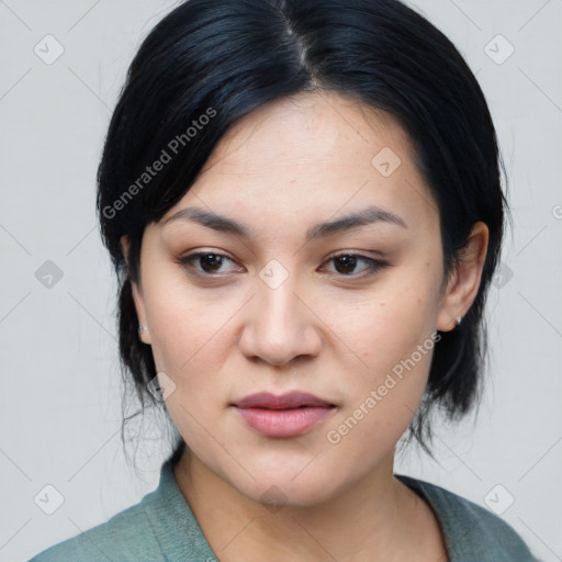 Joyful asian young-adult female with medium  black hair and brown eyes