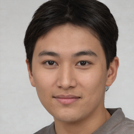 Neutral asian young-adult male with short  brown hair and brown eyes