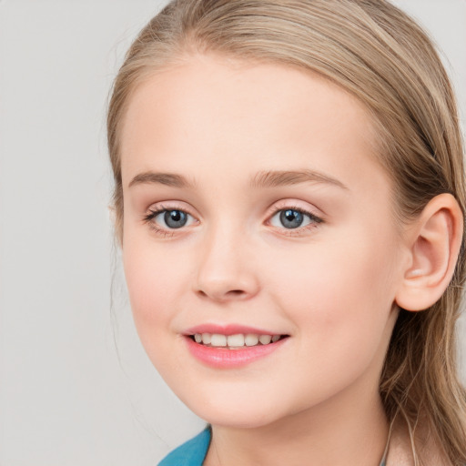 Joyful white child female with long  brown hair and blue eyes