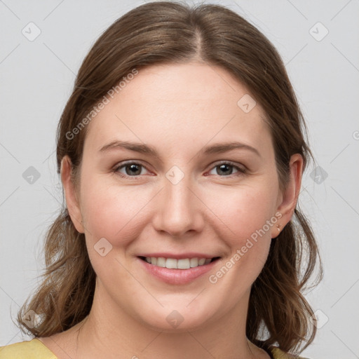 Joyful white young-adult female with medium  brown hair and grey eyes