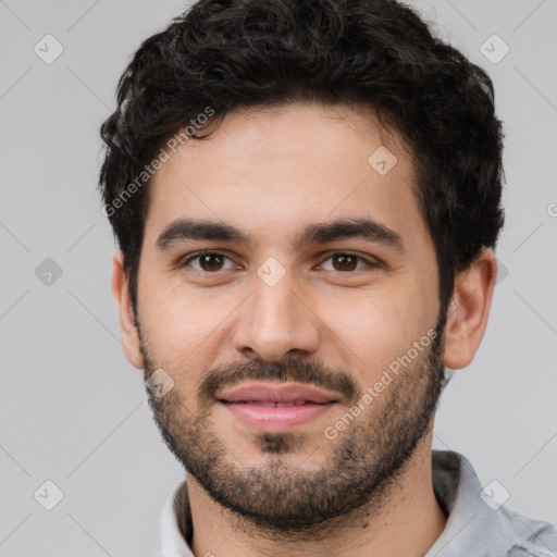 Joyful white young-adult male with short  black hair and brown eyes