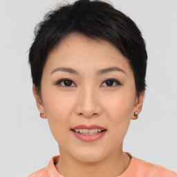 Joyful asian young-adult female with short  brown hair and brown eyes