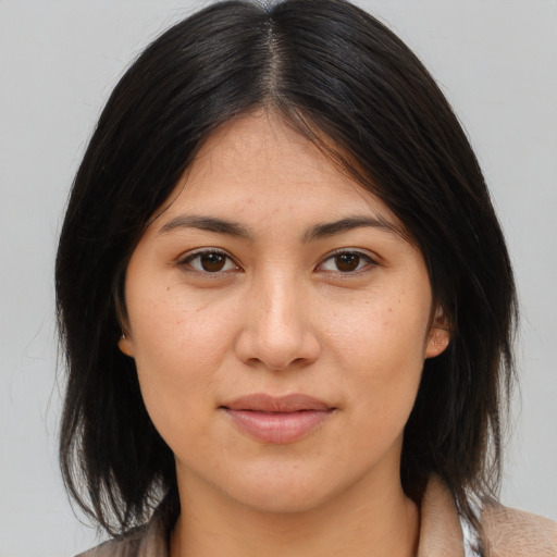 Joyful asian young-adult female with medium  brown hair and brown eyes