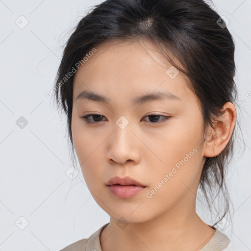 Neutral asian young-adult female with medium  brown hair and brown eyes