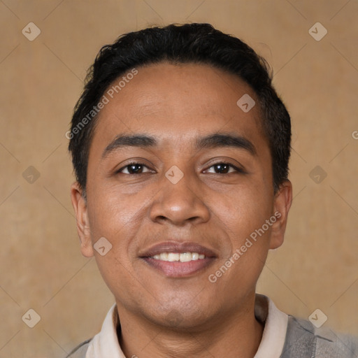 Joyful latino young-adult male with short  black hair and brown eyes