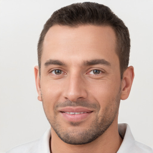 Joyful white young-adult male with short  brown hair and brown eyes