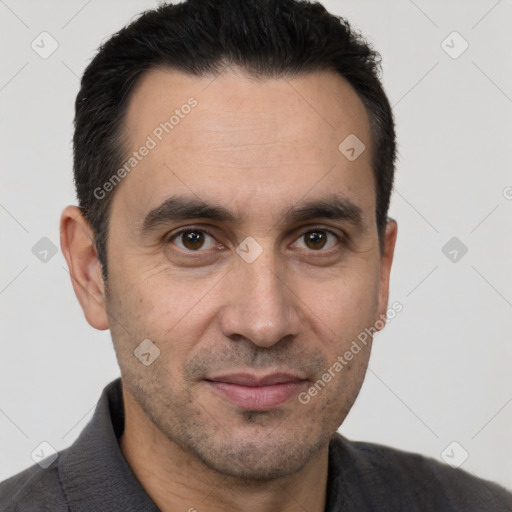 Joyful white adult male with short  brown hair and brown eyes