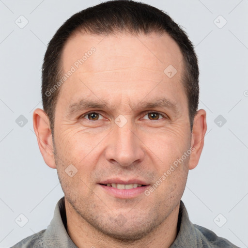 Joyful white adult male with short  brown hair and brown eyes