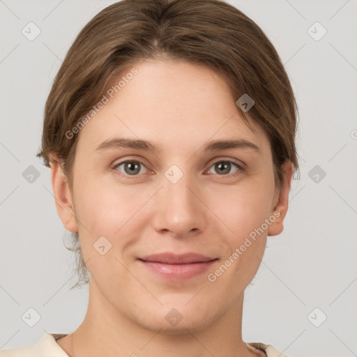 Joyful white young-adult female with short  brown hair and grey eyes