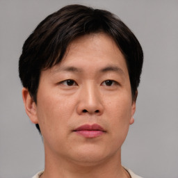 Neutral asian young-adult male with short  brown hair and brown eyes