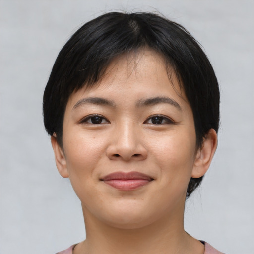 Joyful asian young-adult female with short  black hair and brown eyes