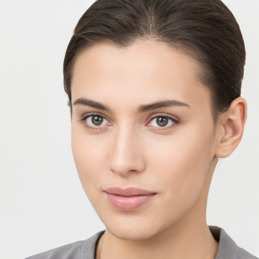 Neutral white young-adult female with medium  brown hair and brown eyes