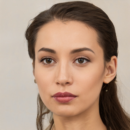 Neutral white young-adult female with long  brown hair and brown eyes