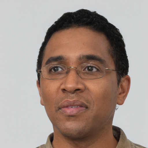 Neutral black adult male with short  black hair and brown eyes