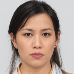 Neutral asian young-adult female with medium  brown hair and brown eyes