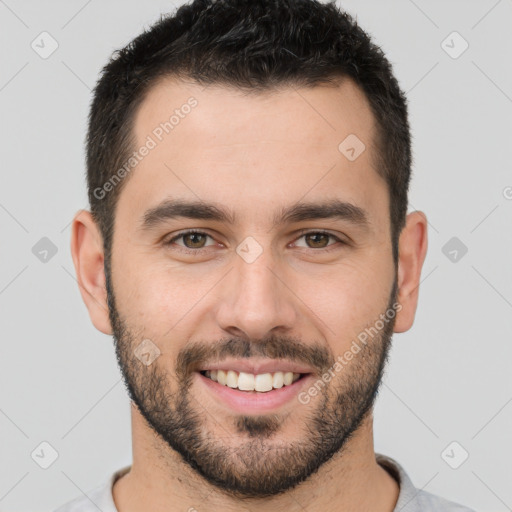 Joyful white young-adult male with short  brown hair and brown eyes