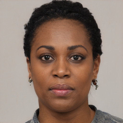 Neutral black young-adult female with short  black hair and brown eyes