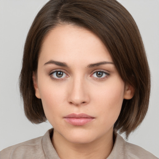 Neutral white young-adult female with medium  brown hair and brown eyes