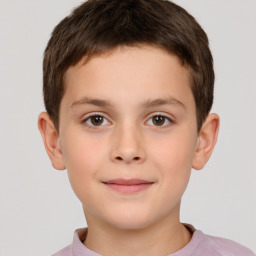 Joyful white child male with short  brown hair and brown eyes