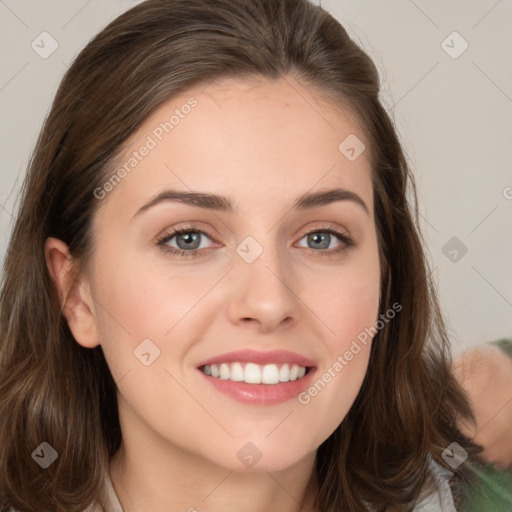 Joyful white young-adult female with long  brown hair and green eyes