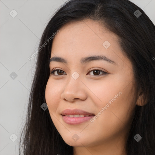 Joyful asian young-adult female with long  brown hair and brown eyes