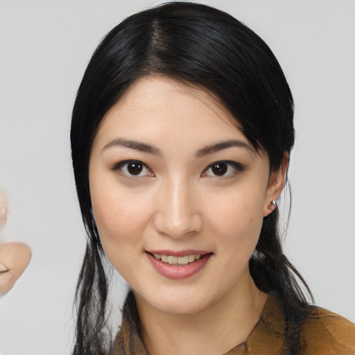 Joyful white young-adult female with medium  black hair and brown eyes