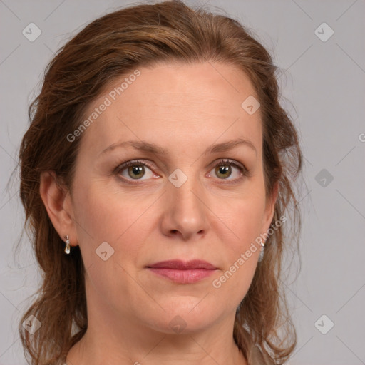 Joyful white adult female with medium  brown hair and blue eyes