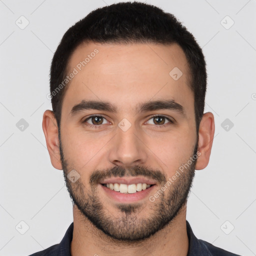 Joyful white young-adult male with short  black hair and brown eyes