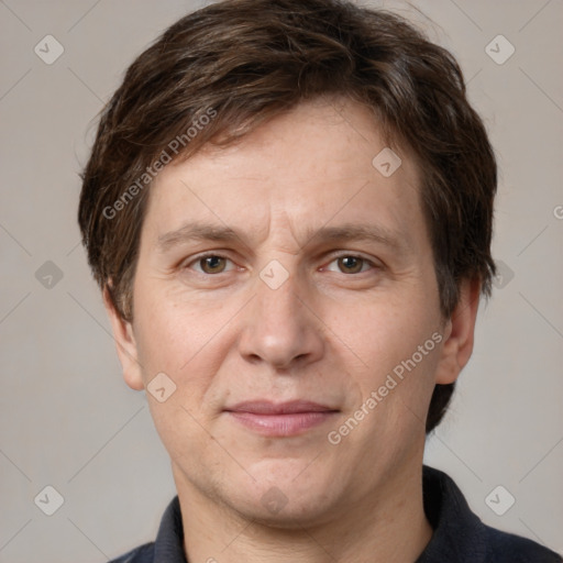 Joyful white adult male with short  brown hair and grey eyes