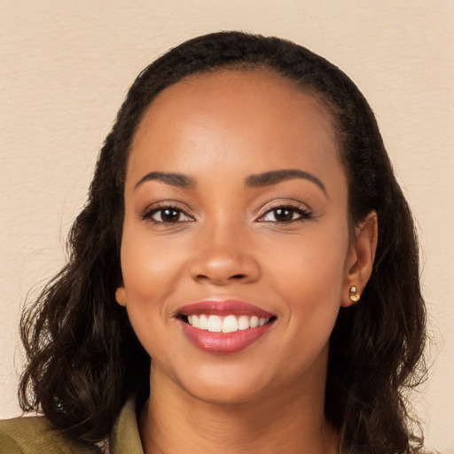 Joyful white young-adult female with long  black hair and brown eyes