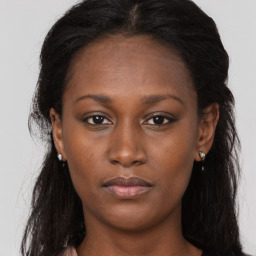 Neutral black young-adult female with long  brown hair and brown eyes