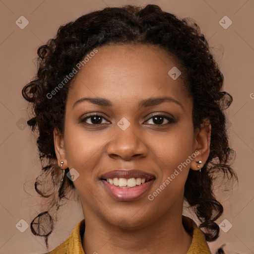 Joyful black young-adult female with long  brown hair and brown eyes