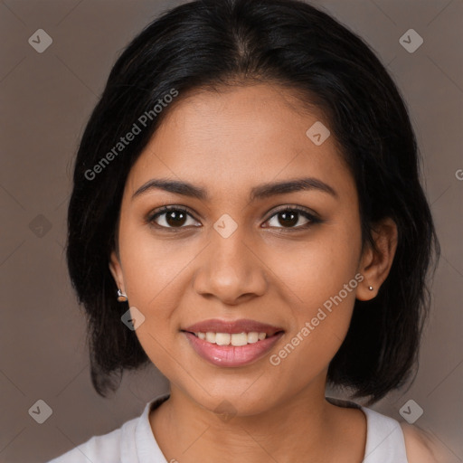 Joyful latino young-adult female with medium  brown hair and brown eyes