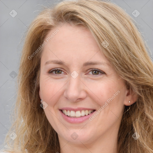 Joyful white adult female with long  brown hair and brown eyes