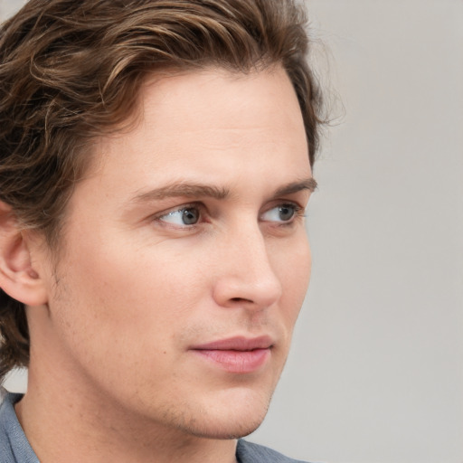 Neutral white young-adult male with medium  brown hair and blue eyes