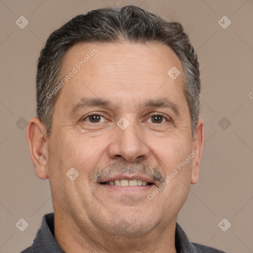 Joyful white middle-aged male with short  brown hair and brown eyes