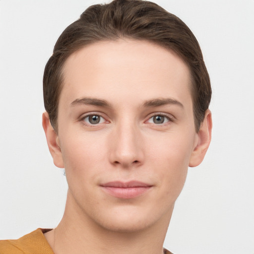 Joyful white young-adult female with short  brown hair and grey eyes