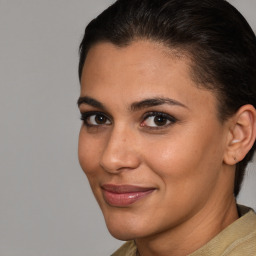 Joyful white young-adult female with short  brown hair and brown eyes