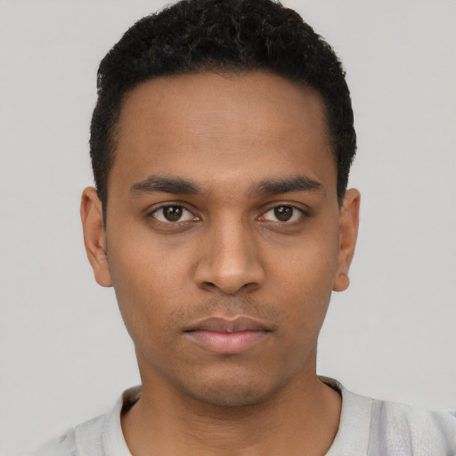 Neutral black young-adult male with short  black hair and brown eyes