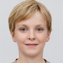 Joyful white child female with short  brown hair and grey eyes