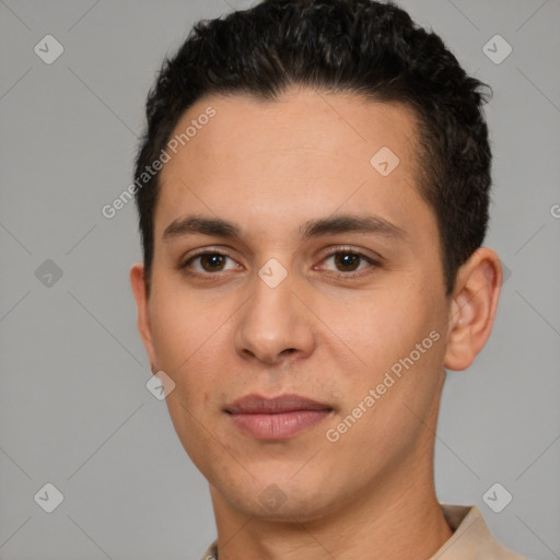 Joyful white young-adult male with short  black hair and brown eyes